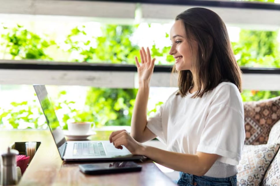 Young woman raising her hand during an online ADHD coaching session about causes and contributing factors