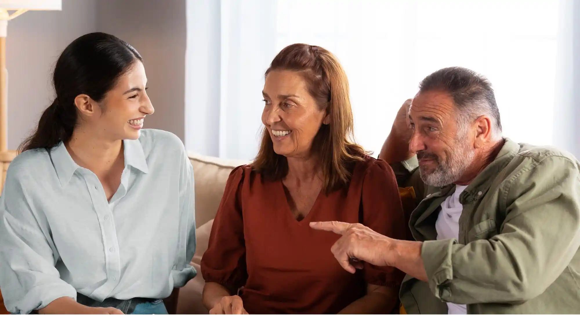 A family of three smiling together.